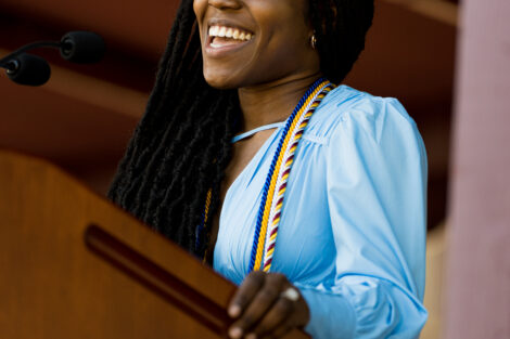 Shantae Shand smiles while talking at a podium