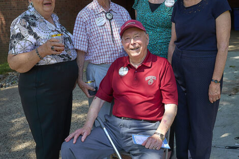 A group of people smile.