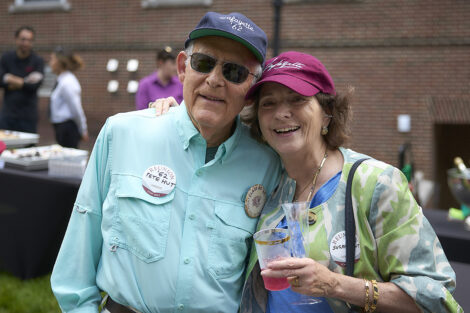Two alumni smile