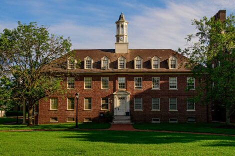 Soles Hall with green grass and a blue clear sky