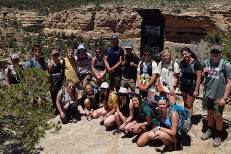Summer 2022 geology students pose in a group photo in front of a national park canyon