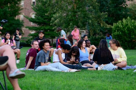 Lafayette students sitting on the lawn of the Quad awaiting the free outdoor movie screening