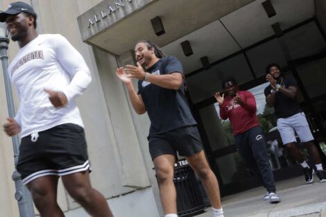 Lafayette football players walking out of the entrance to Allan P. Kirby Sports Center