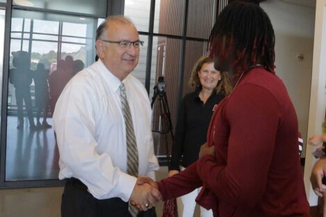 Easton Mayor Sal Panto shakes hands with Lafayette College football player