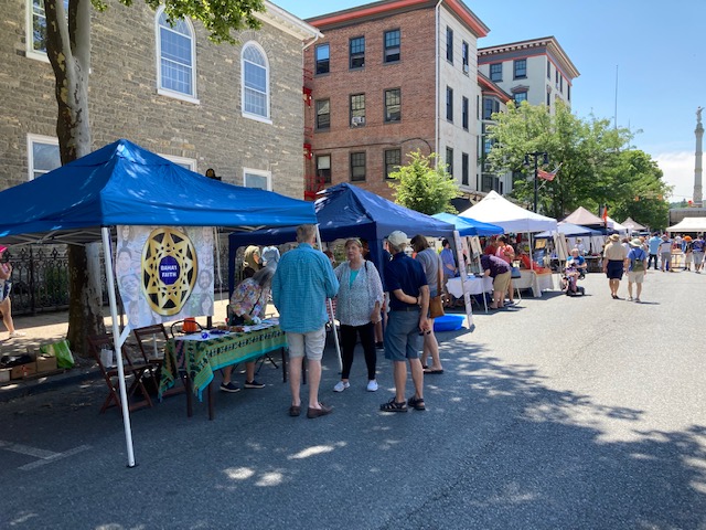 Blue tents line a street in Easton
