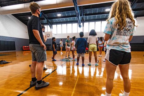 Lafayette students gather with young Easton students in a gymnasium
